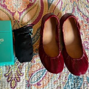 Size 9 Ruby Red Tieks.  Gently worn a handful of times.